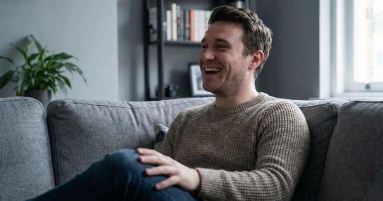 Founder is sitting on the couch, in the middle of the afternoon, having a light moment to help himself beat the grind and regain focus