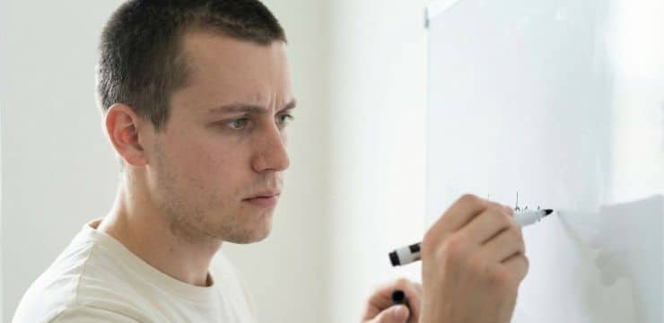 Get Recommended by AI Generative engine optimization strategy, creator writing clear statement on whiteboard for ai visibility in daylight workspace