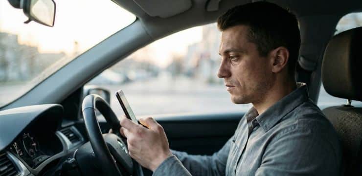 Revenue Over Vanity Metrics Keyword intent strategy decision, founder in parked car at dawn reviewing phone before changing content approach